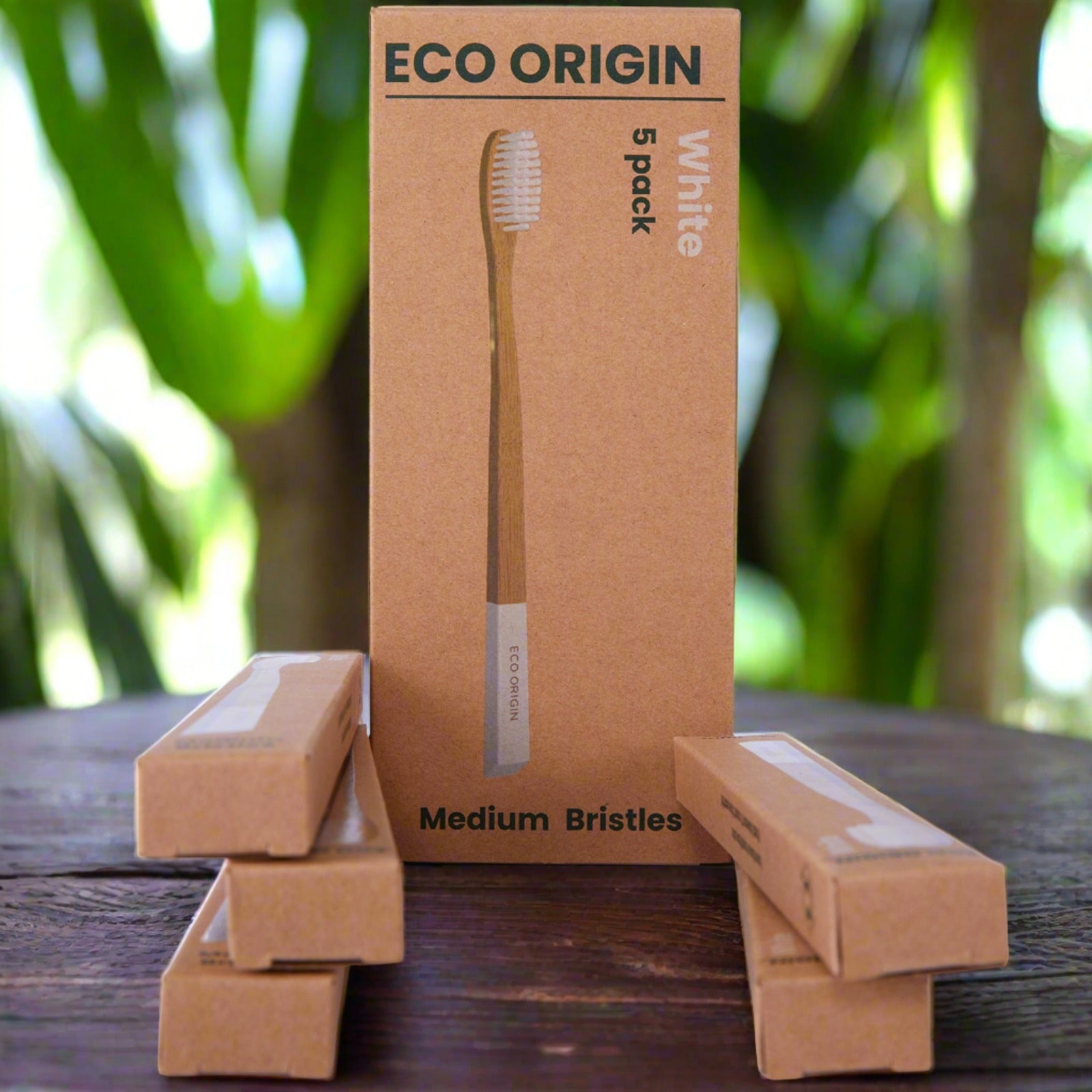 Eco Origin bamboo toothbrush 5-pack with white medium bristles in eco-friendly packaging. Eco Origin bamboo toothbrush 5-pack with white medium bristles in eco-friendly packaging.