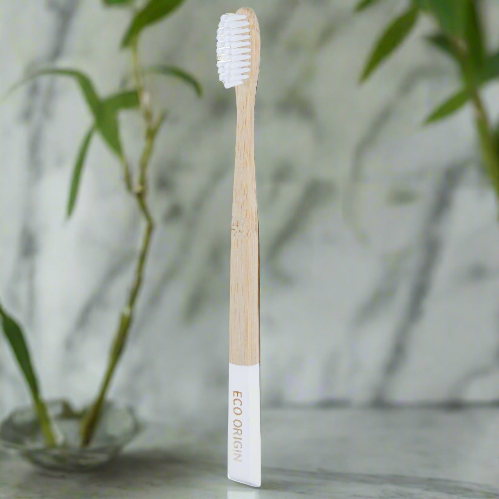 Eco Origin bamboo toothbrush with white medium bristles and eco-friendly design